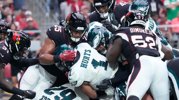 Philadelphia Eagles quarterback Jalen Hurts (1) scores a touchdown against the Arizona Cardinals during the first quarter at State Farm Stadium.